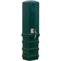 A tall, rectangular green electric pedestal with a rounded top, locked with a latch. A warning label is affixed to the front. The box stands on a ridged base and has the word 