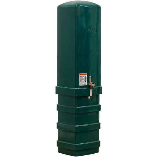 A tall, rectangular green electric pedestal with a rounded top, locked with a latch. A warning label is affixed to the front. The box stands on a ridged base and has the word 